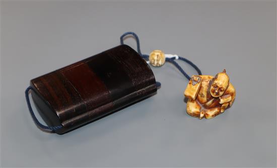 A Japanese hardwood three case inro with signed netsuke of a carpenter